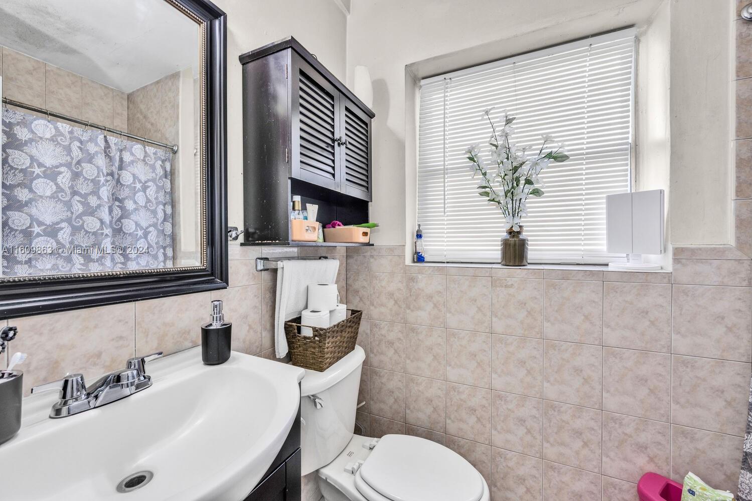 3430 Southwest 11th Street Miami, FL 33135 - Photo 19 of 21 a bathroom with a sink a toilet and tub