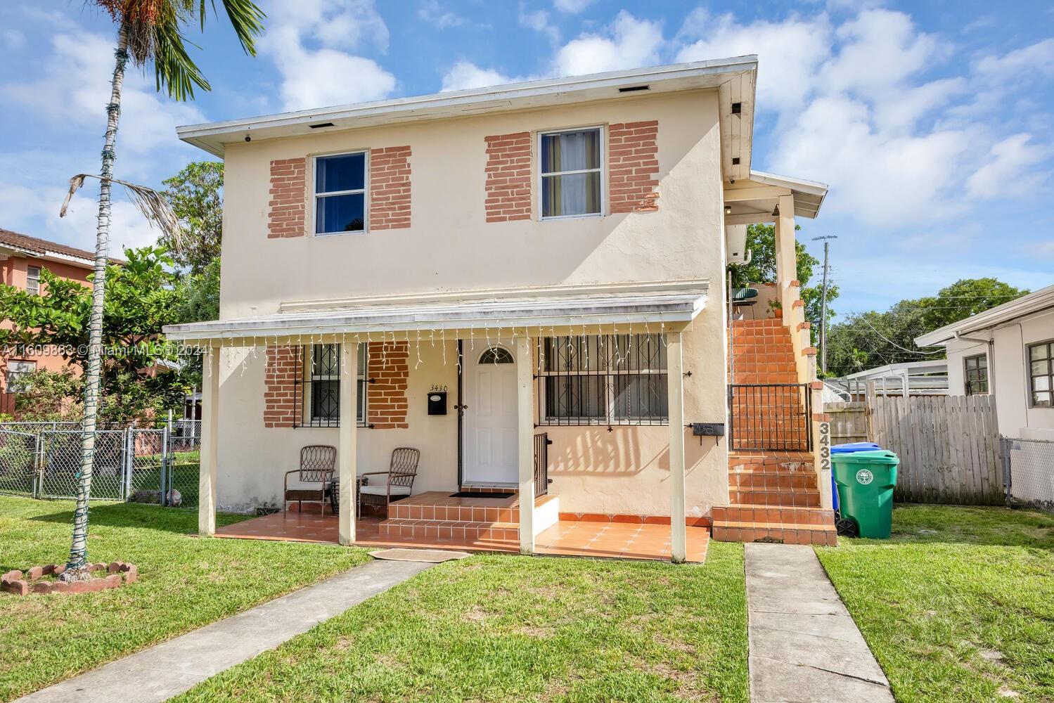 3430 Southwest 11th Street Miami, FL 33135 - Photo 2 of 21 a front view of house with yard and green space