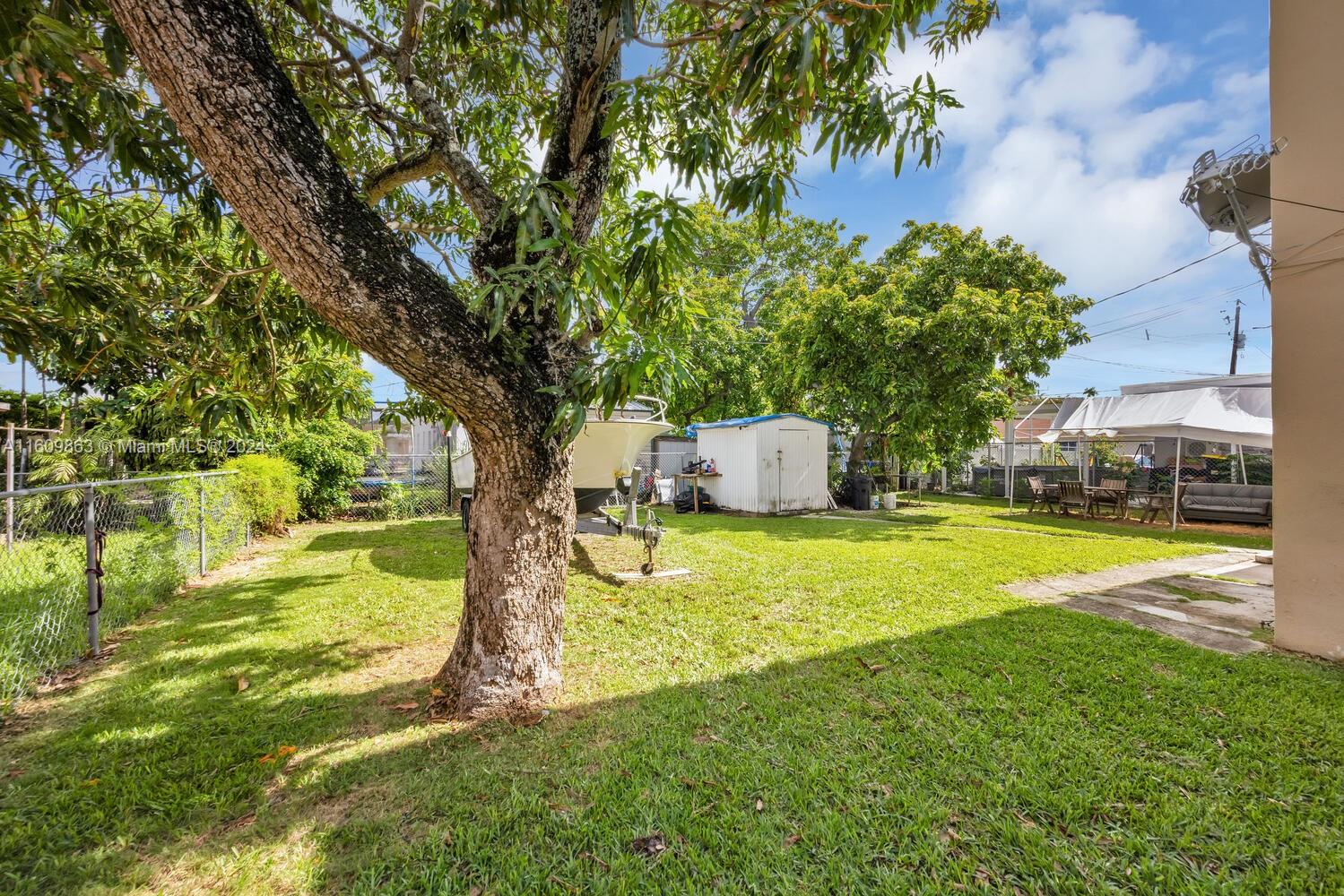 3430 Southwest 11th Street Miami, FL 33135 - Photo 21 of 21 a house with swimming pool in front of it