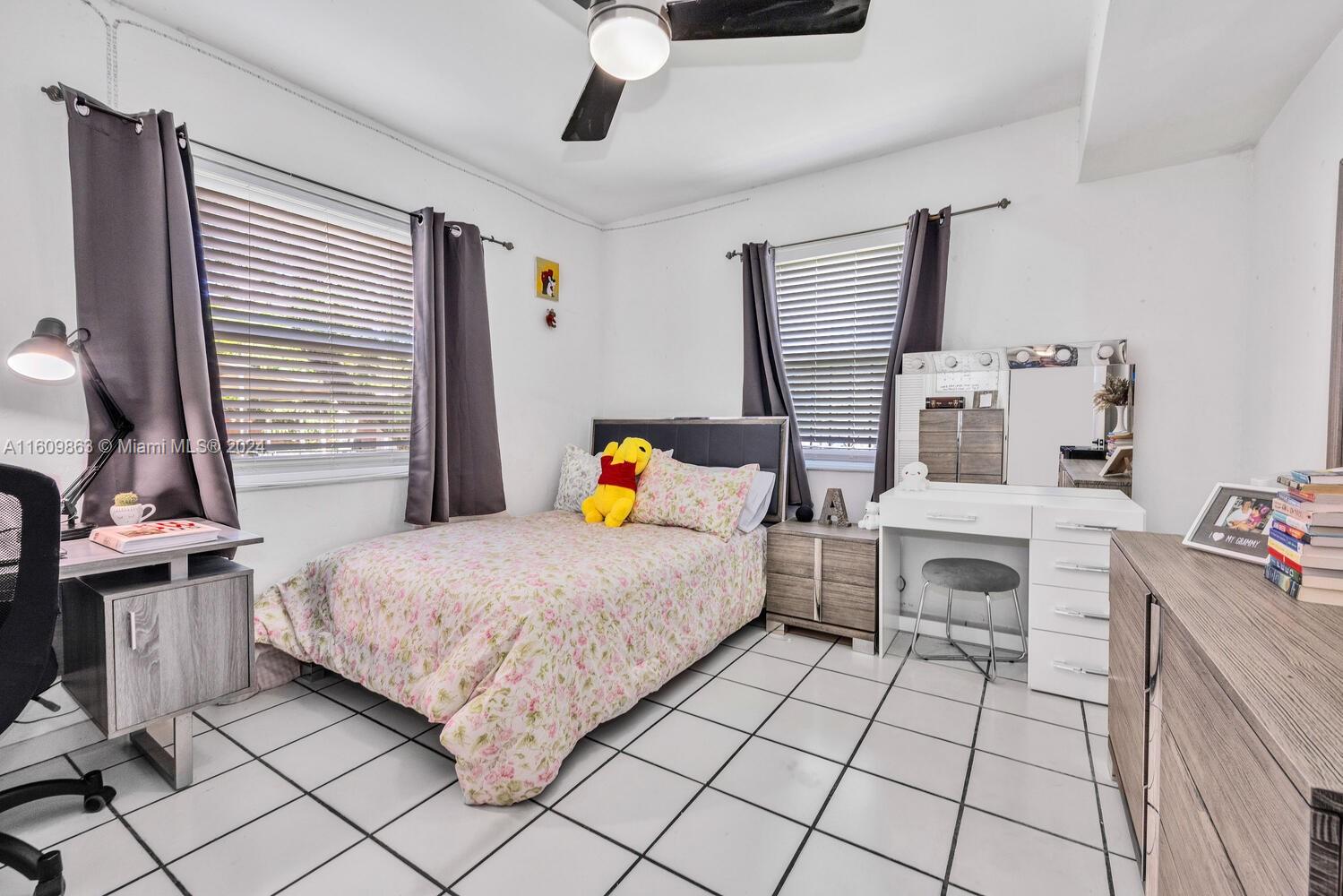 3430 Southwest 11th Street Miami, FL 33135 - Photo 8 of 21 a bedroom with a bed and a stove top oven