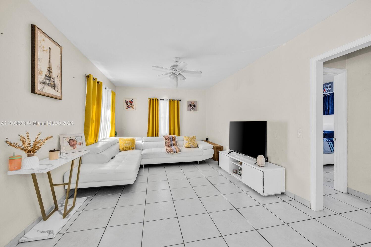 3430 Southwest 11th Street Miami, FL 33135 - Photo 10 of 21 a living room with furniture and a flat screen tv