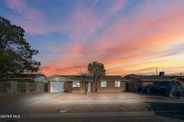 a view of houses with a street