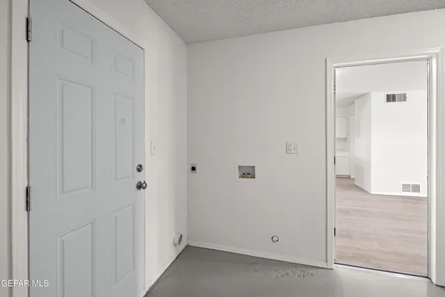 a kitchen with a sink stove top oven and cabinets
