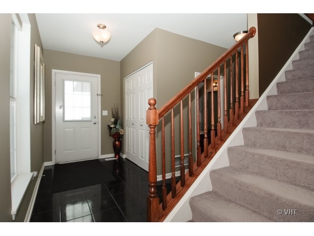 914 Oak Ridge Boulevard Elgin, IL 60120 - Photo 2 of 15 a view of a hallway with windows and stairs
