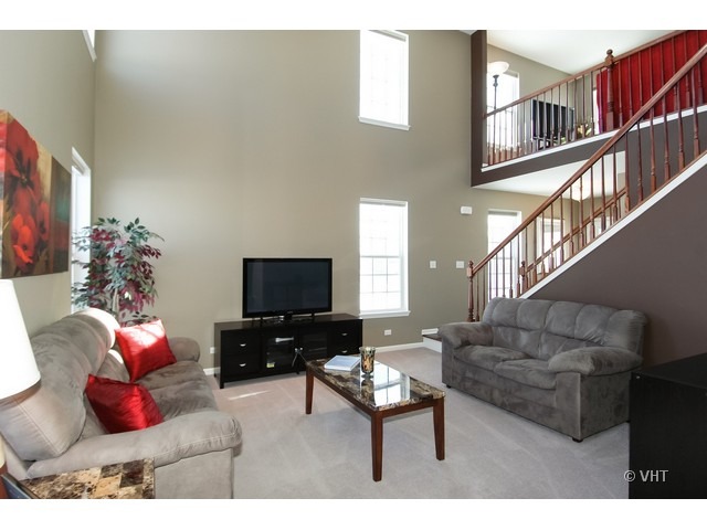 914 Oak Ridge Boulevard Elgin, IL 60120 - Photo 4 of 15 a living room with furniture and a flat screen tv
