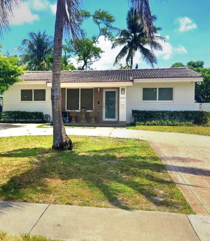 a view of a house with swimming pool and a yard with furniture