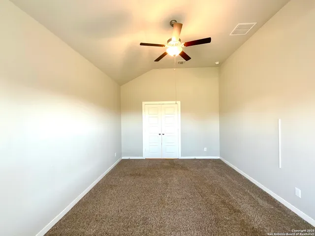 a view of a big room with carpet