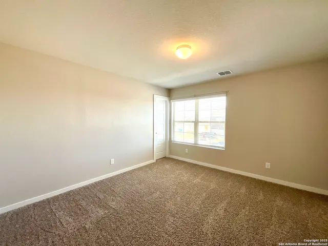 an empty room with a empty space and a window