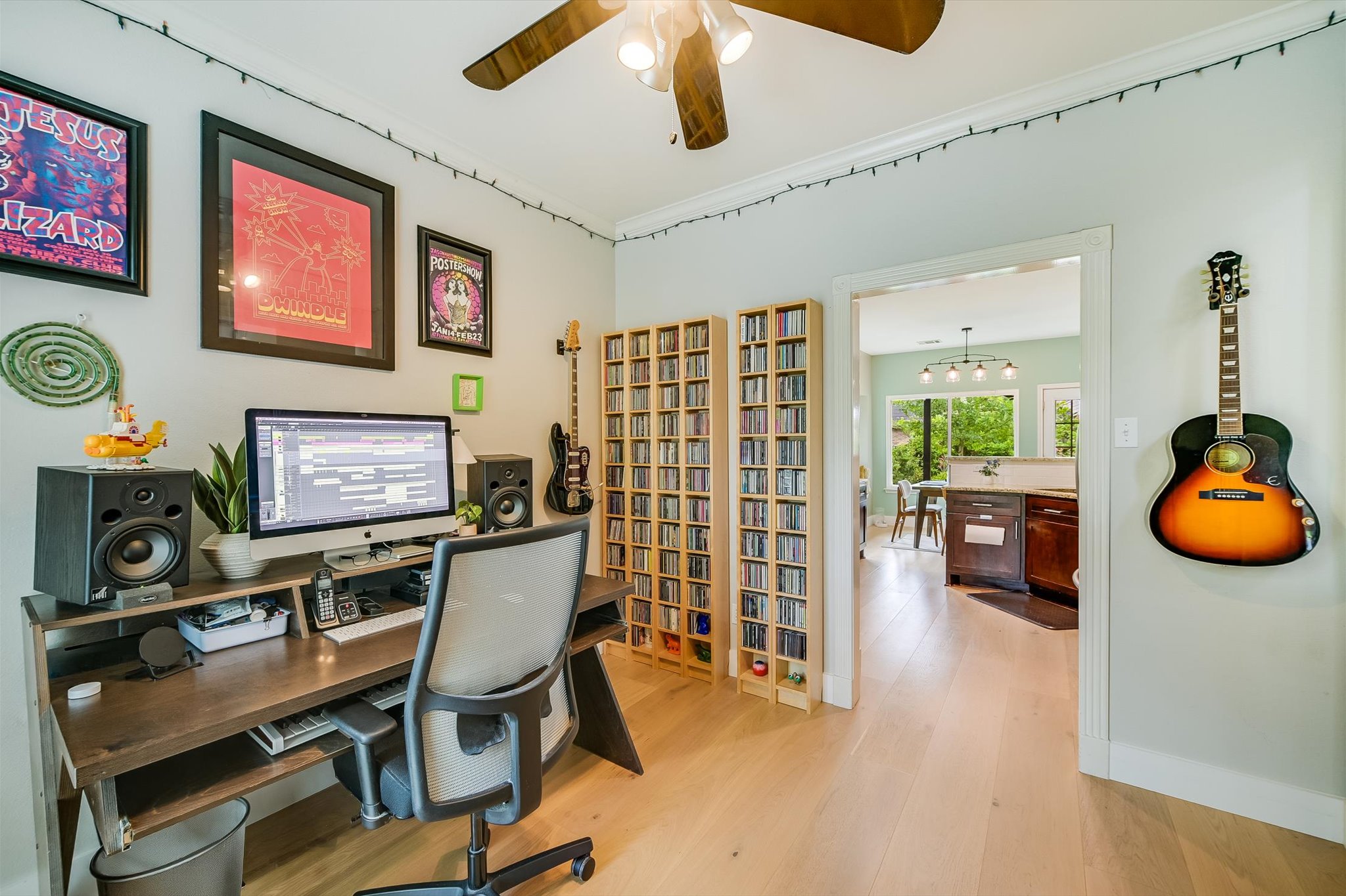 6456 Ruxton Lane Austin, TX 78749 - Photo 7 of 30 A dedicated home office provides ample space for productivity and creativity, featuring polished hardwood floors and seamless access to the dining area.