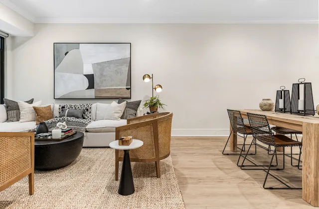 a living room with furniture and a lamp