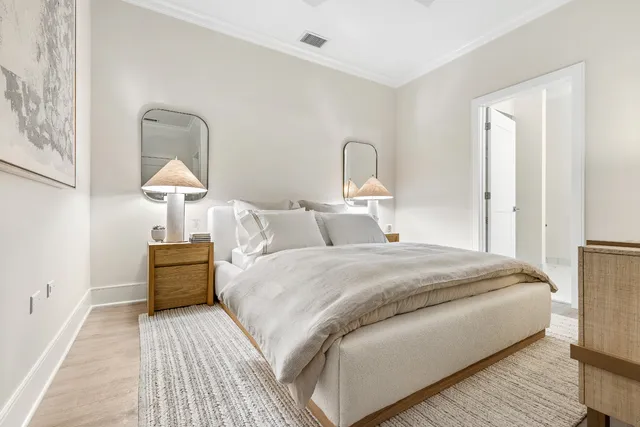 a bedroom with bed and a table