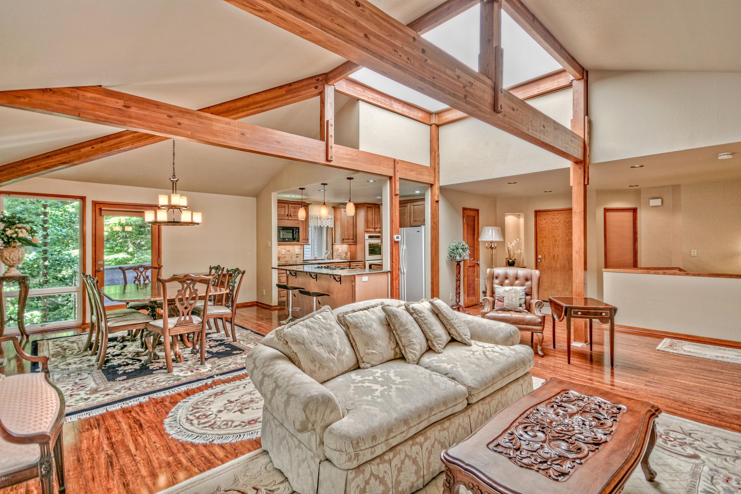 17 Big Tree Road Gleneden Beach, OR 97388 - Photo 8 of 52 a living room with furniture a rug and a large window