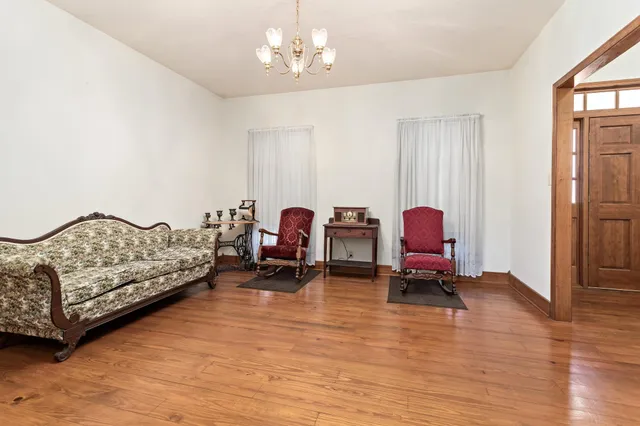a bedroom with bed and window