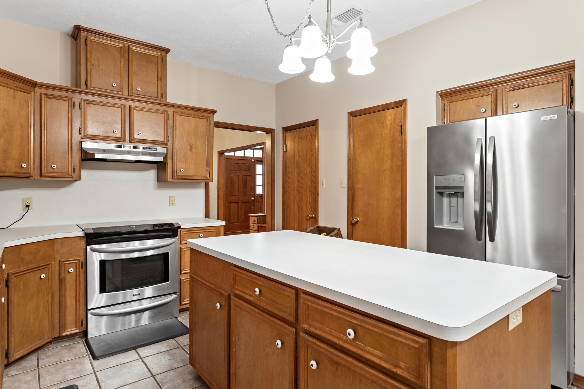 3084 Highway 63 Jasper, TX 75951 - Photo 16 of 44 a kitchen with stainless steel appliances a stove a refrigerator a sink and cabinets