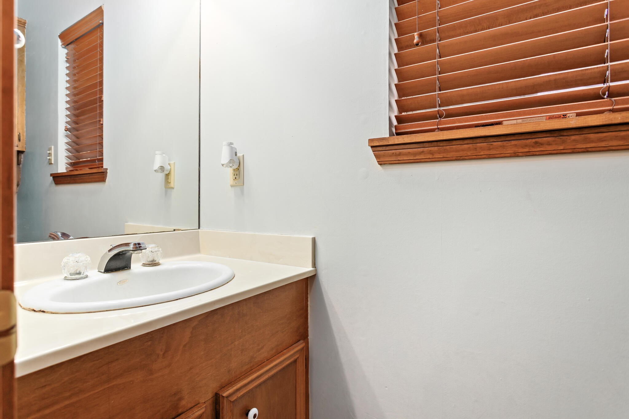 3084 Highway 63 Jasper, TX 75951 - Photo 19 of 44 a bathroom with a sink and a mirror