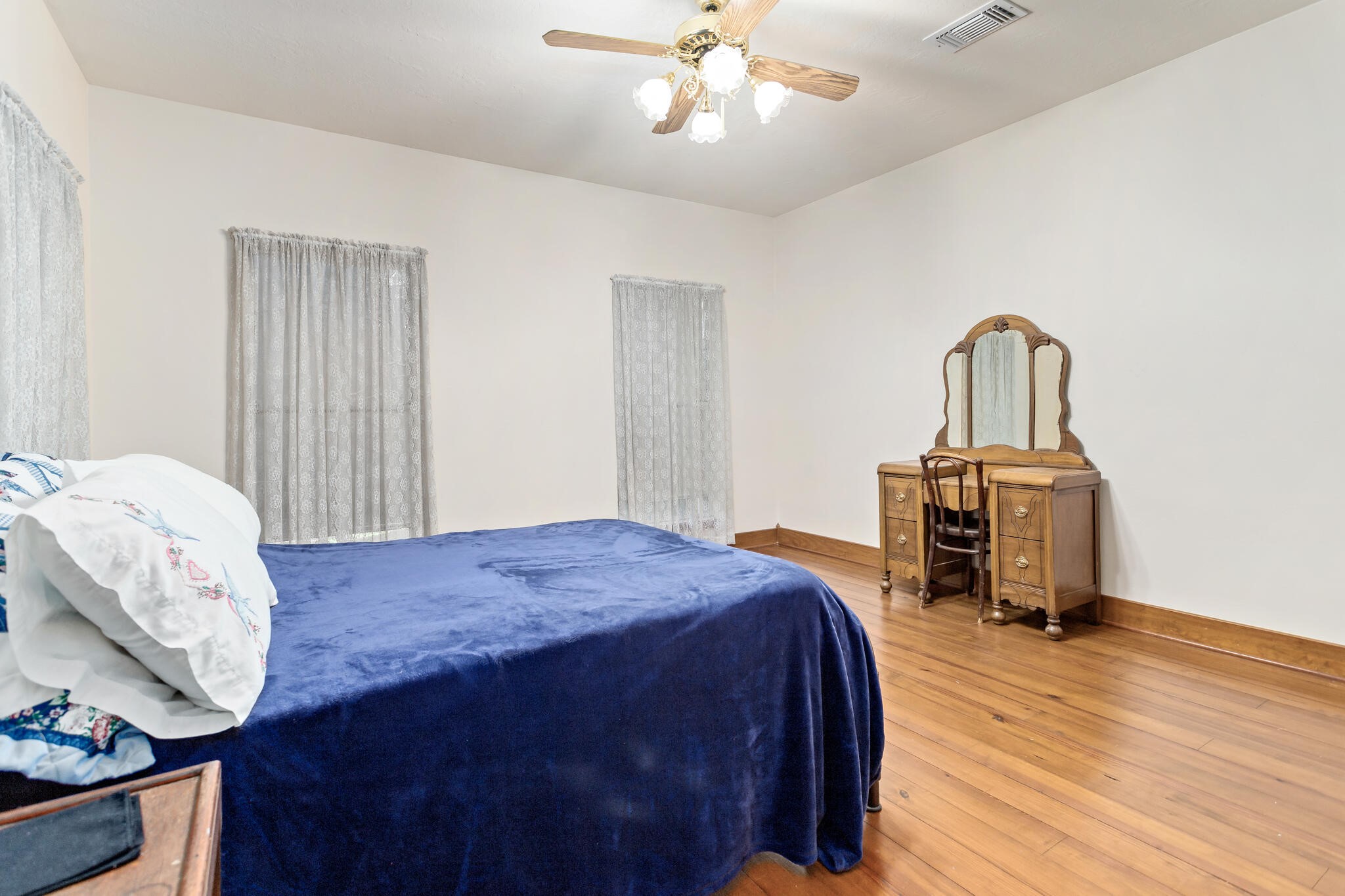 3084 Highway 63 Jasper, TX 75951 - Photo 25 of 44 a bedroom with a bed and wooden floor