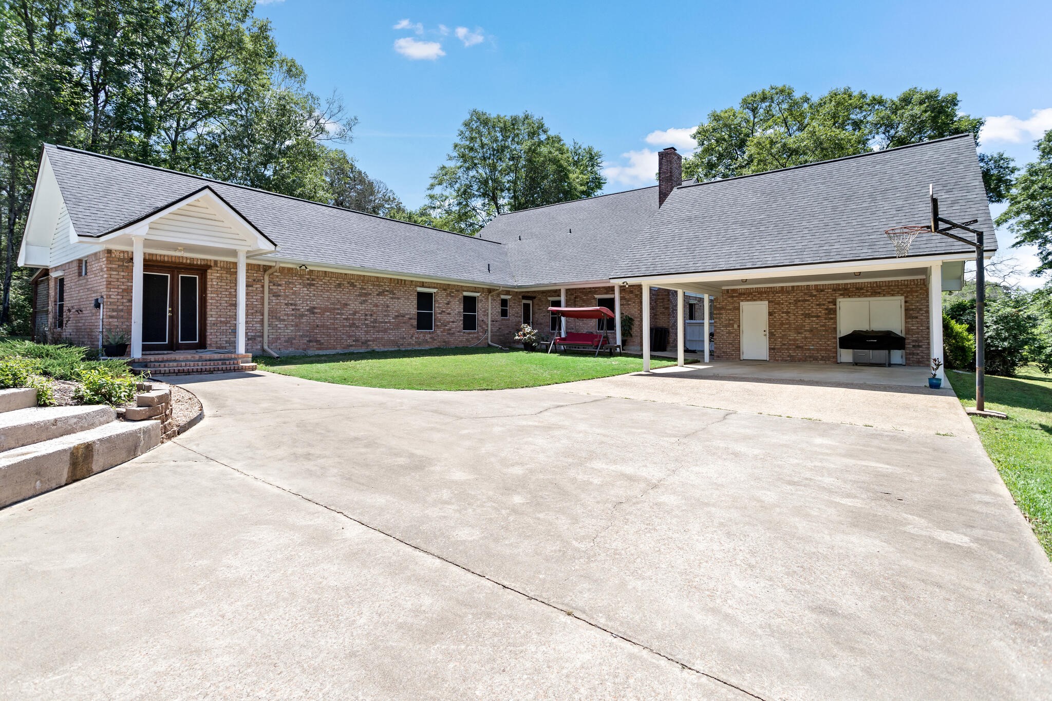3084 Highway 63 Jasper, TX 75951 - Photo 30 of 44 a front view of a house with a yard and potted plants