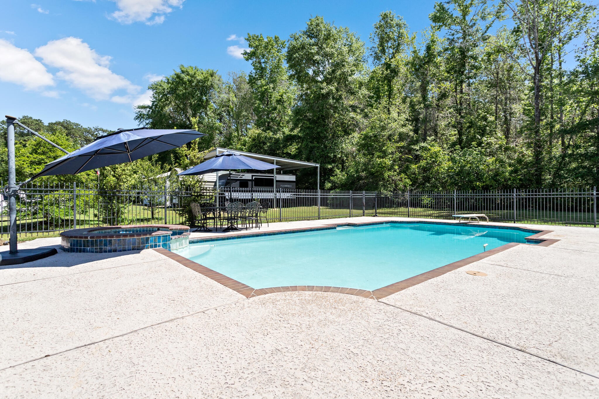 3084 Highway 63 Jasper, TX 75951 - Photo 32 of 44 a view of a swimming pool with a patio