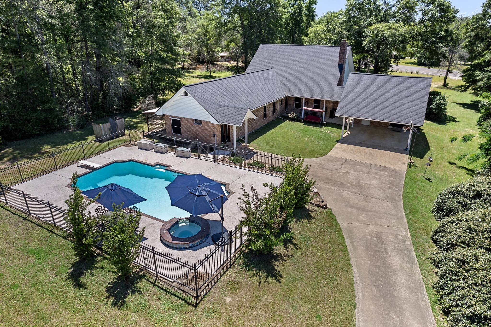 3084 Highway 63 Jasper, TX 75951 - Photo 35 of 44 an aerial view of a house with yard and patio