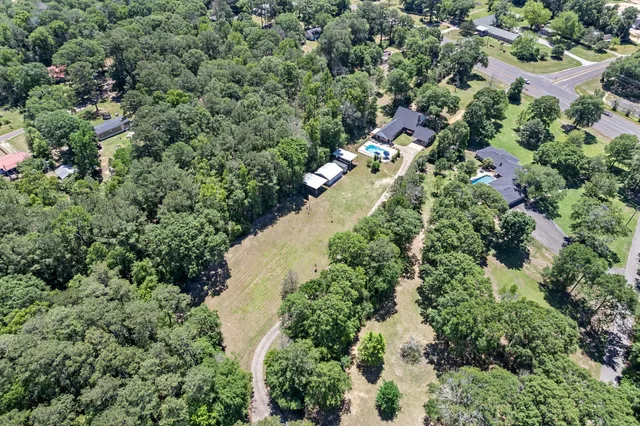 an aerial view of residential house with outdoor space