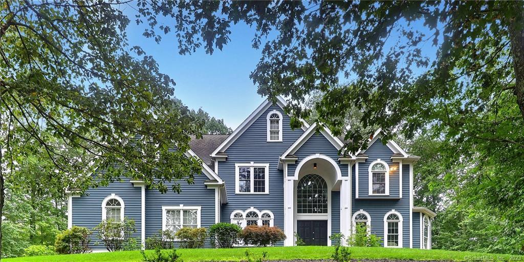 19 Clapboard Ridge Newtown, CT 06482 - Photo 1 of 1 a front view of a house with garden