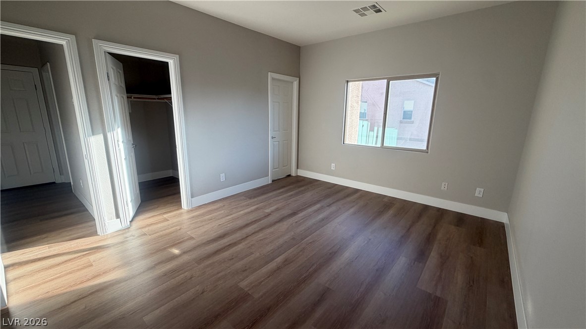 9453 Alma Ridge Avenue Las Vegas, NV 89178 - Photo 10 of 25 Rich hardwood-style flooring extends across this naturally illuminated, adaptable room.