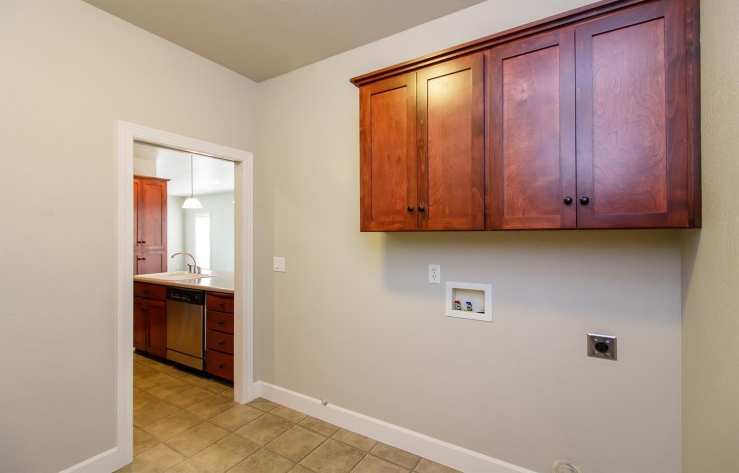 1135 Rustler Peak Street Central Point, OR 97502 - Photo 7 of 17 a view of a kitchen with an entryway