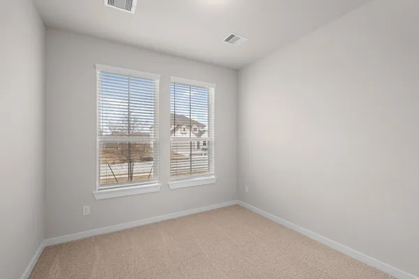 an empty room with closet area