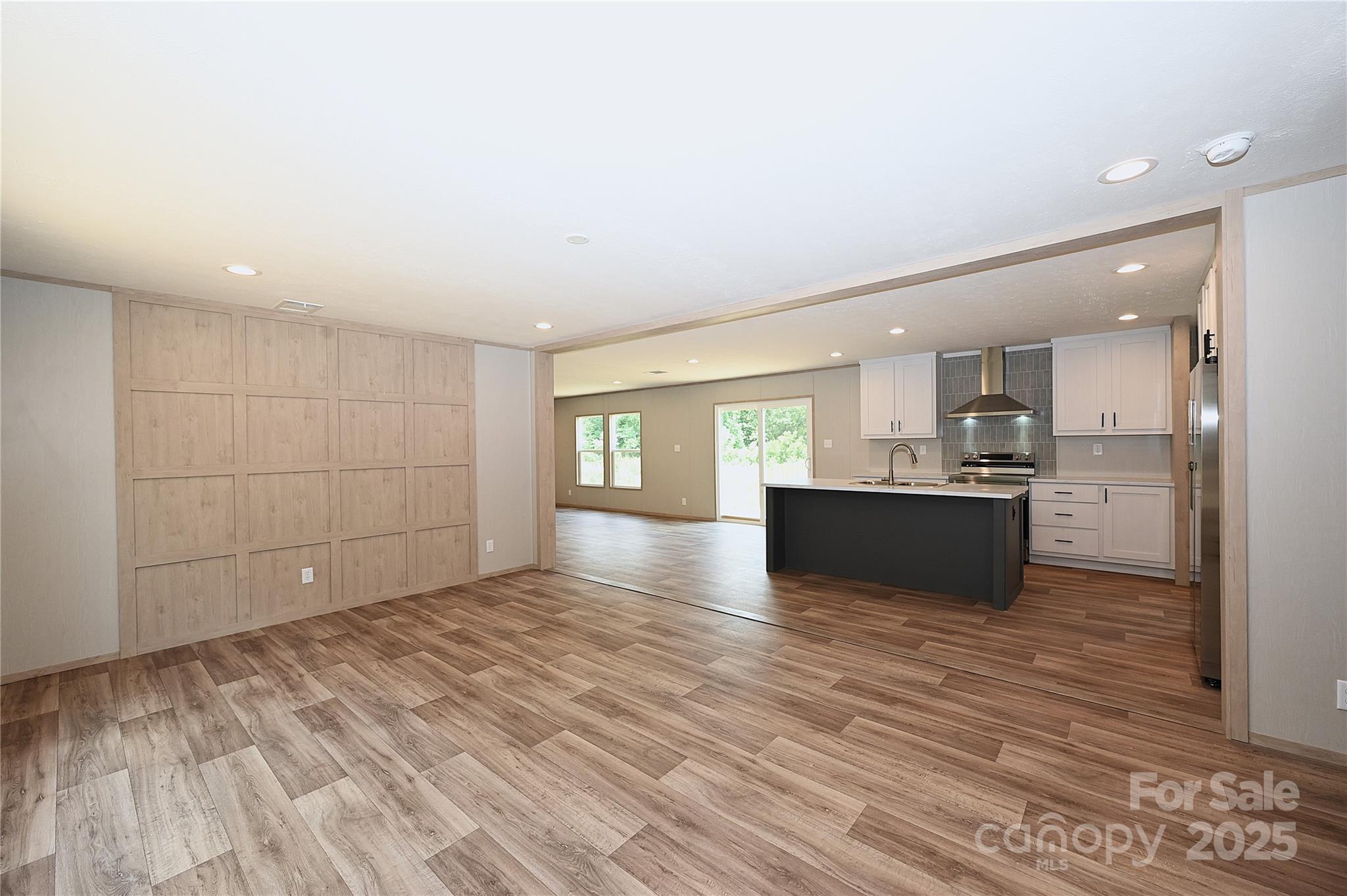 1213 Renno Road Clinton, SC 29325 - Photo 12 of 17 a view of kitchen and hall with wooden floor