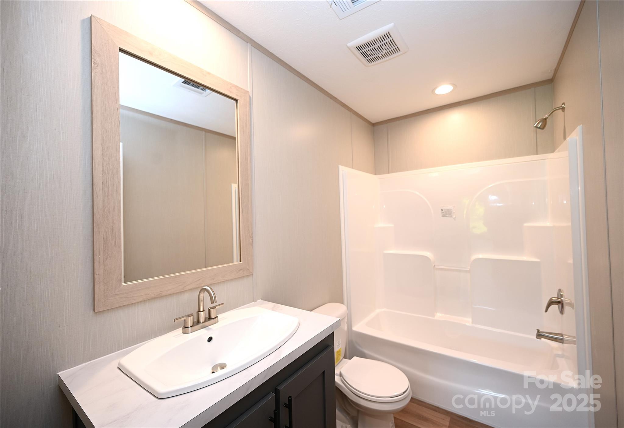 1213 Renno Road Clinton, SC 29325 - Photo 14 of 17 a bathroom with a sink a toilet and shower