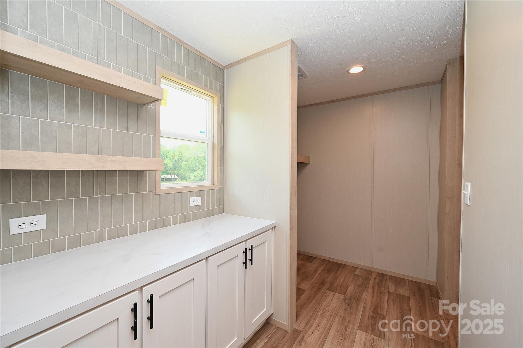 1213 Renno Road Clinton, SC 29325 - Photo 6 of 17 a view of a kitchen with a sink and dishwasher in it