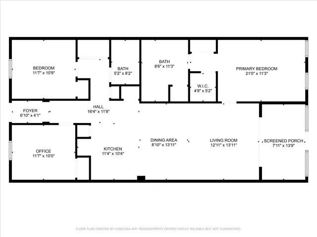 a view of a big yard with a house in the background