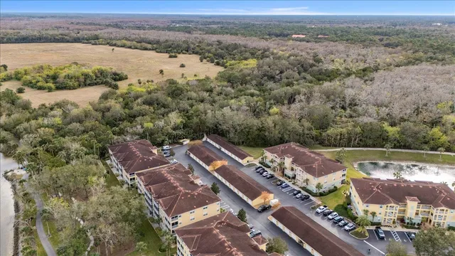an aerial view of a house with a lake view