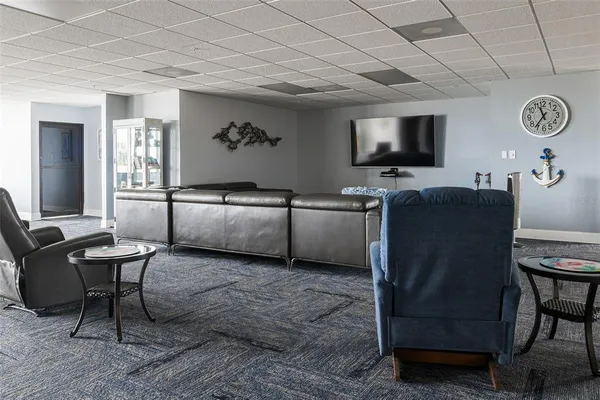 a view of a livingroom with furniture and a flat screen tv