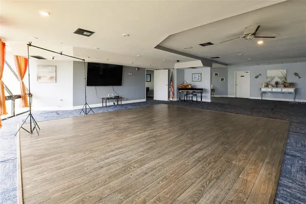 a living room with pool table and a flat screen tv