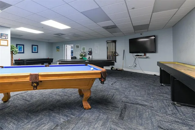 a room with furniture a piano and wooden floor