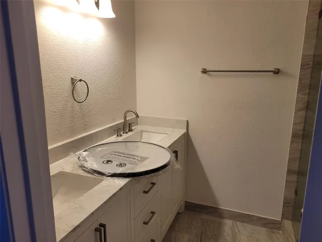 a bathroom with a shower and toilet