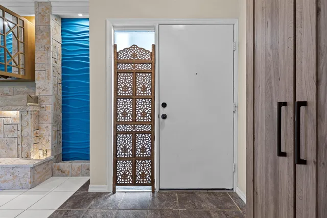 a view of front door with outdoor shower