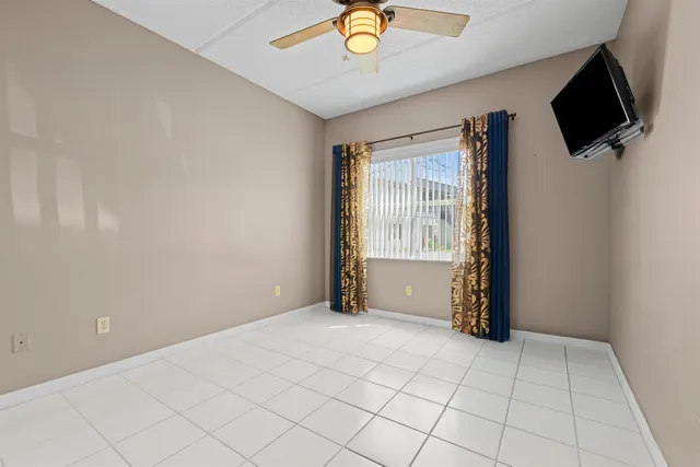 a view of an empty room with a tv