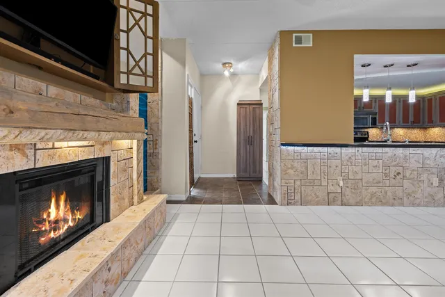 a view of a livingroom with an empty space and fire place