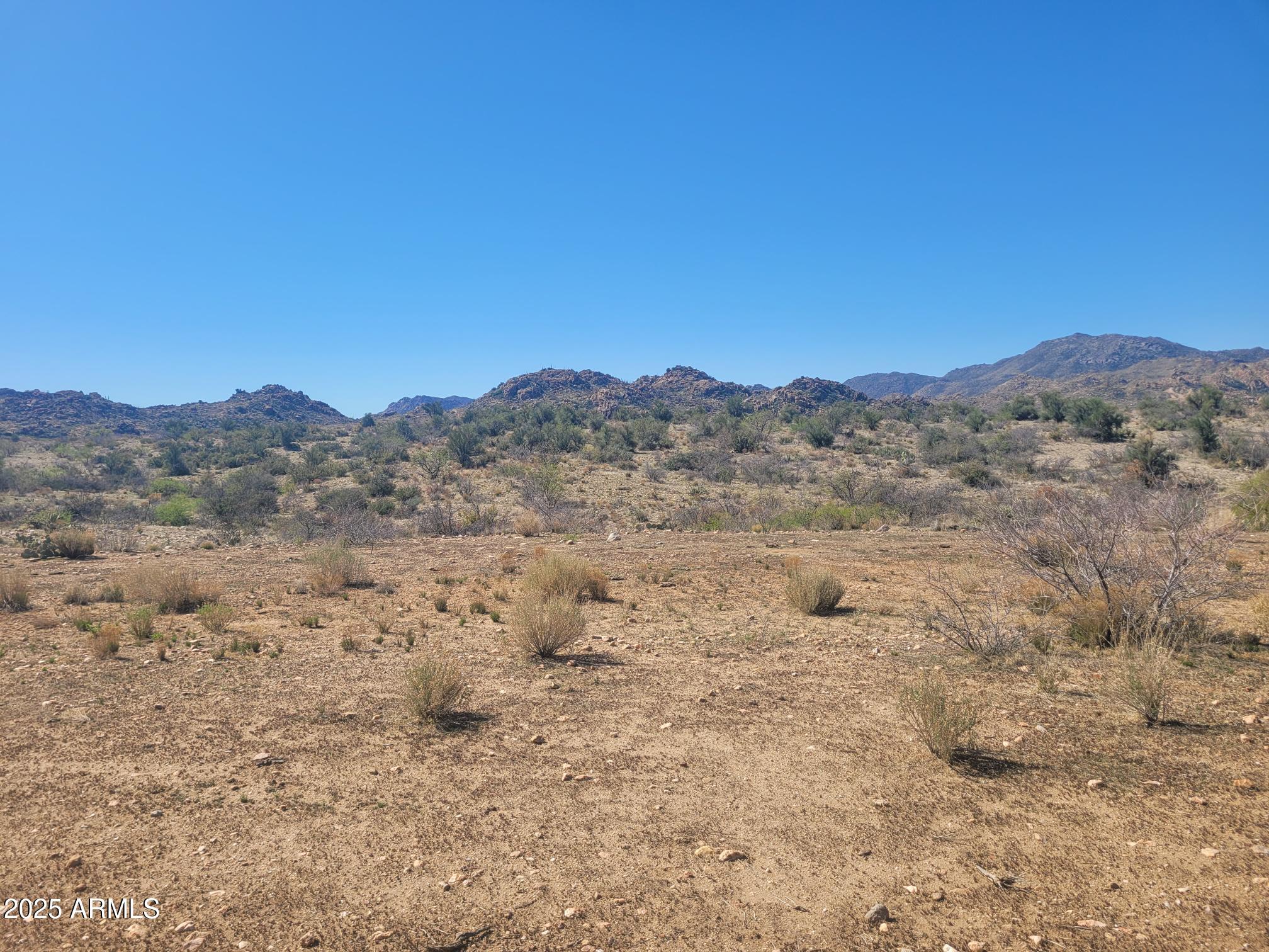 0 South Date Creek Road, Unit PARCEL H Congress, AZ 85332 - Photo 4 of 14 a view of a mountain in the distance