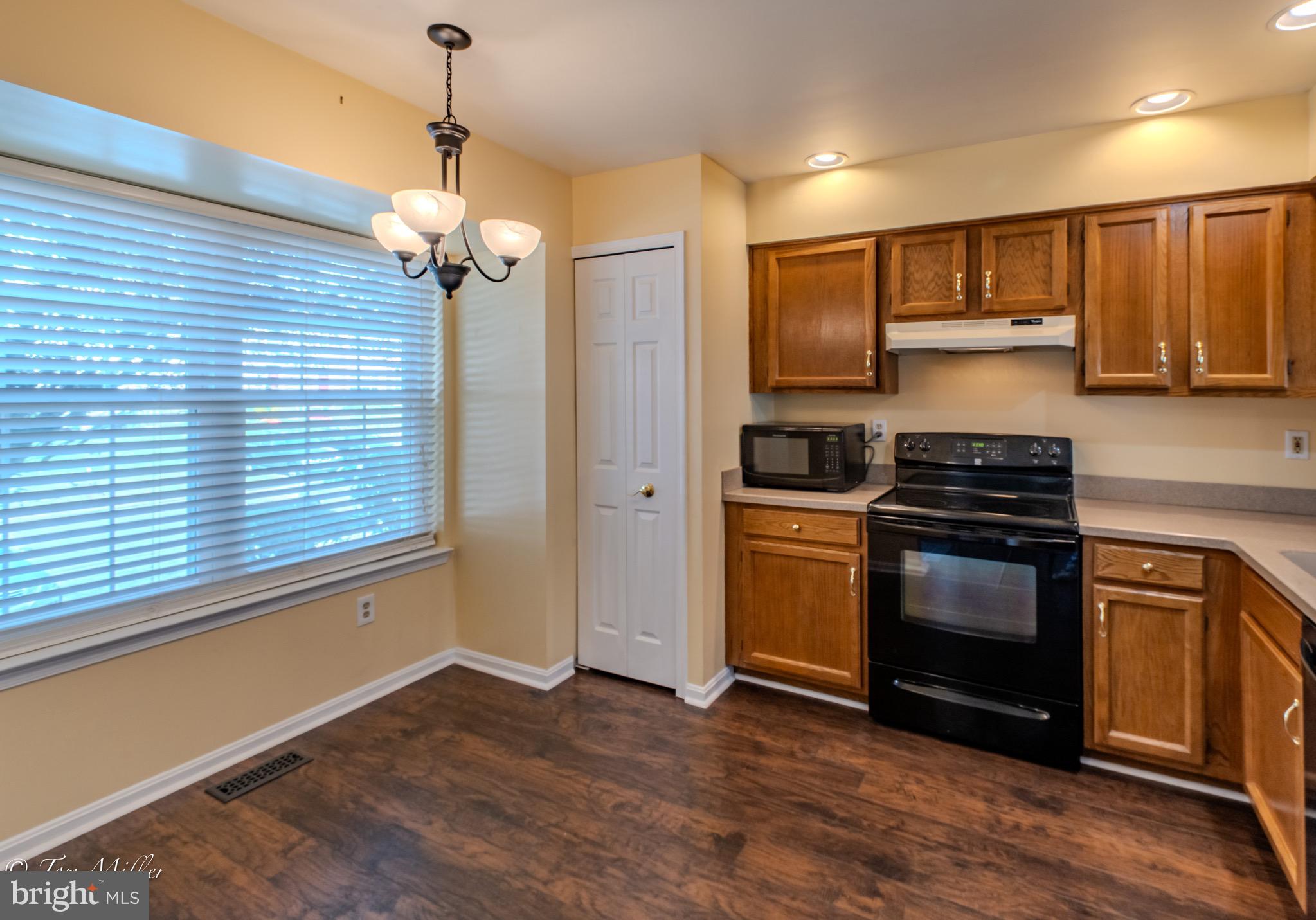 3721 Foxford Stream Road Nottingham, MD 21236 - Photo 12 of 48 a kitchen with stainless steel appliances granite countertop a stove a sink and a refrigerator