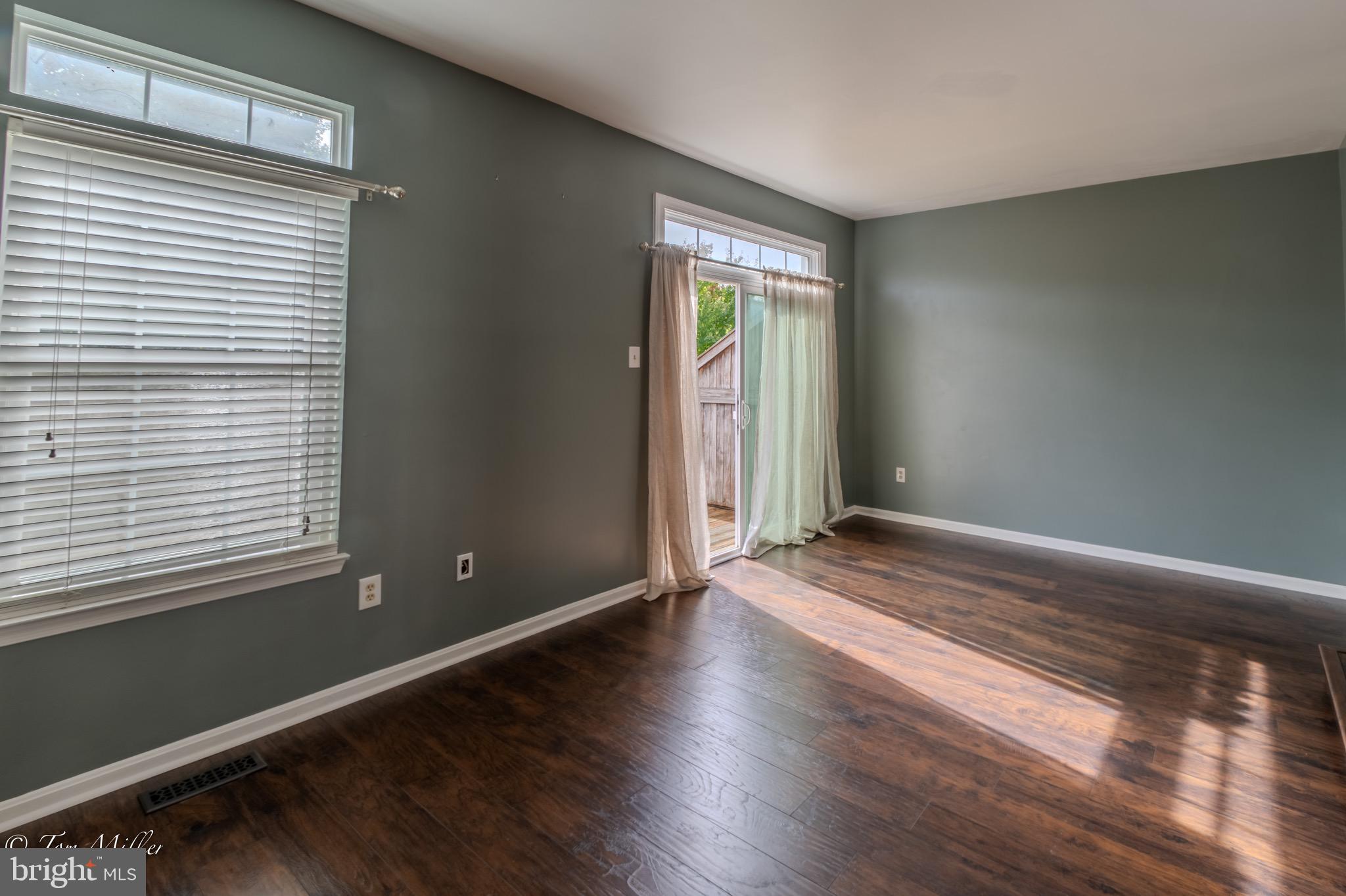 3721 Foxford Stream Road Nottingham, MD 21236 - Photo 18 of 48 an empty room with wooden floor and windows