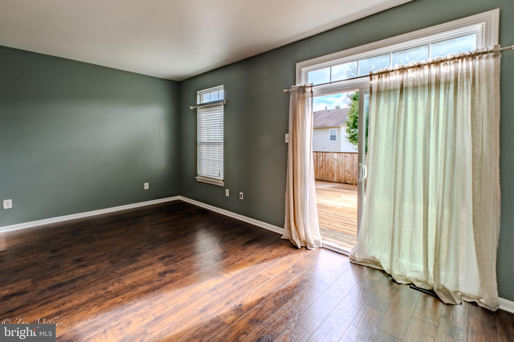 3721 Foxford Stream Road Nottingham, MD 21236 - Photo 20 of 48 a view of an empty room with wooden floor and a window