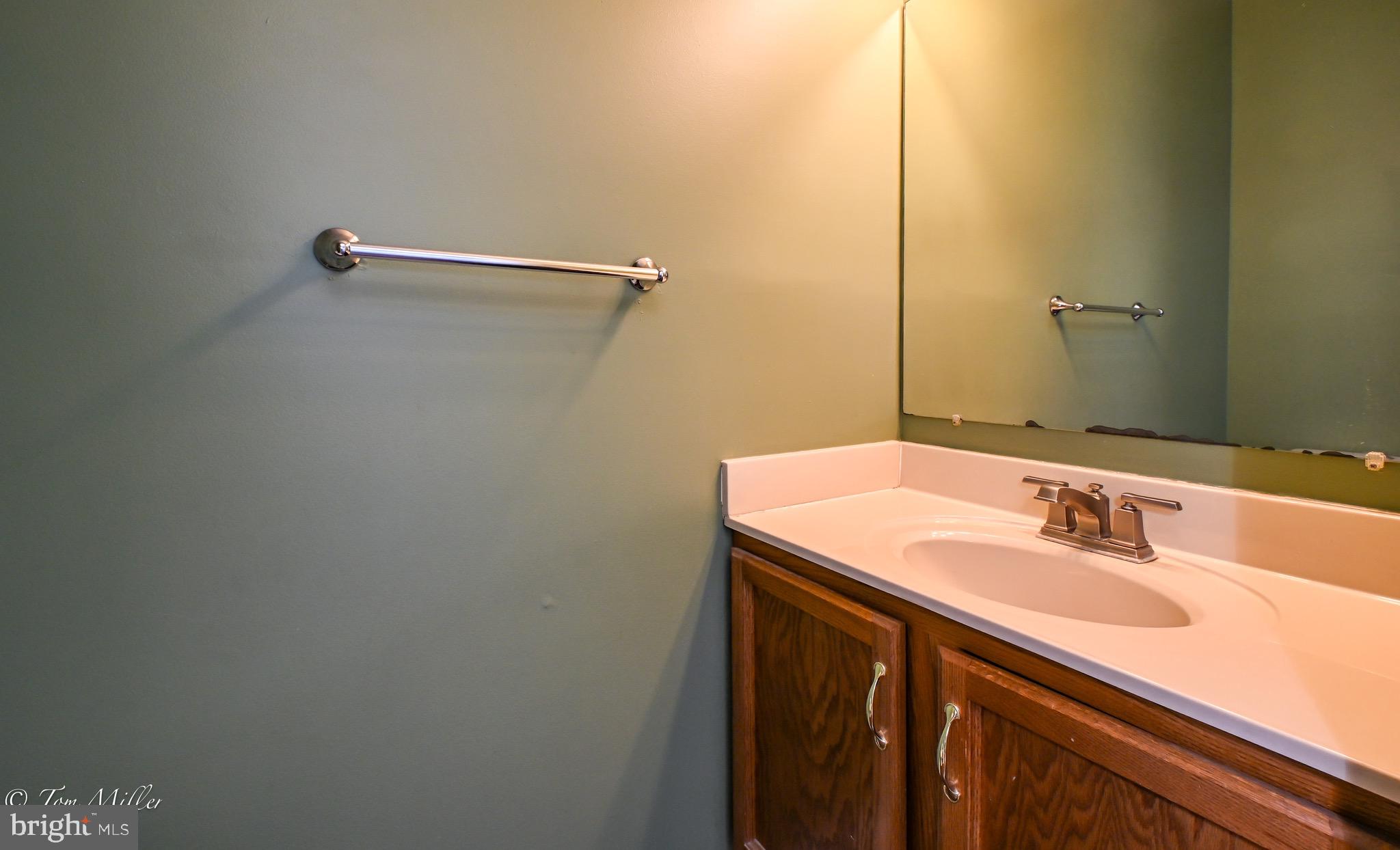 3721 Foxford Stream Road Nottingham, MD 21236 - Photo 22 of 48 a bathroom with a sink and a mirror