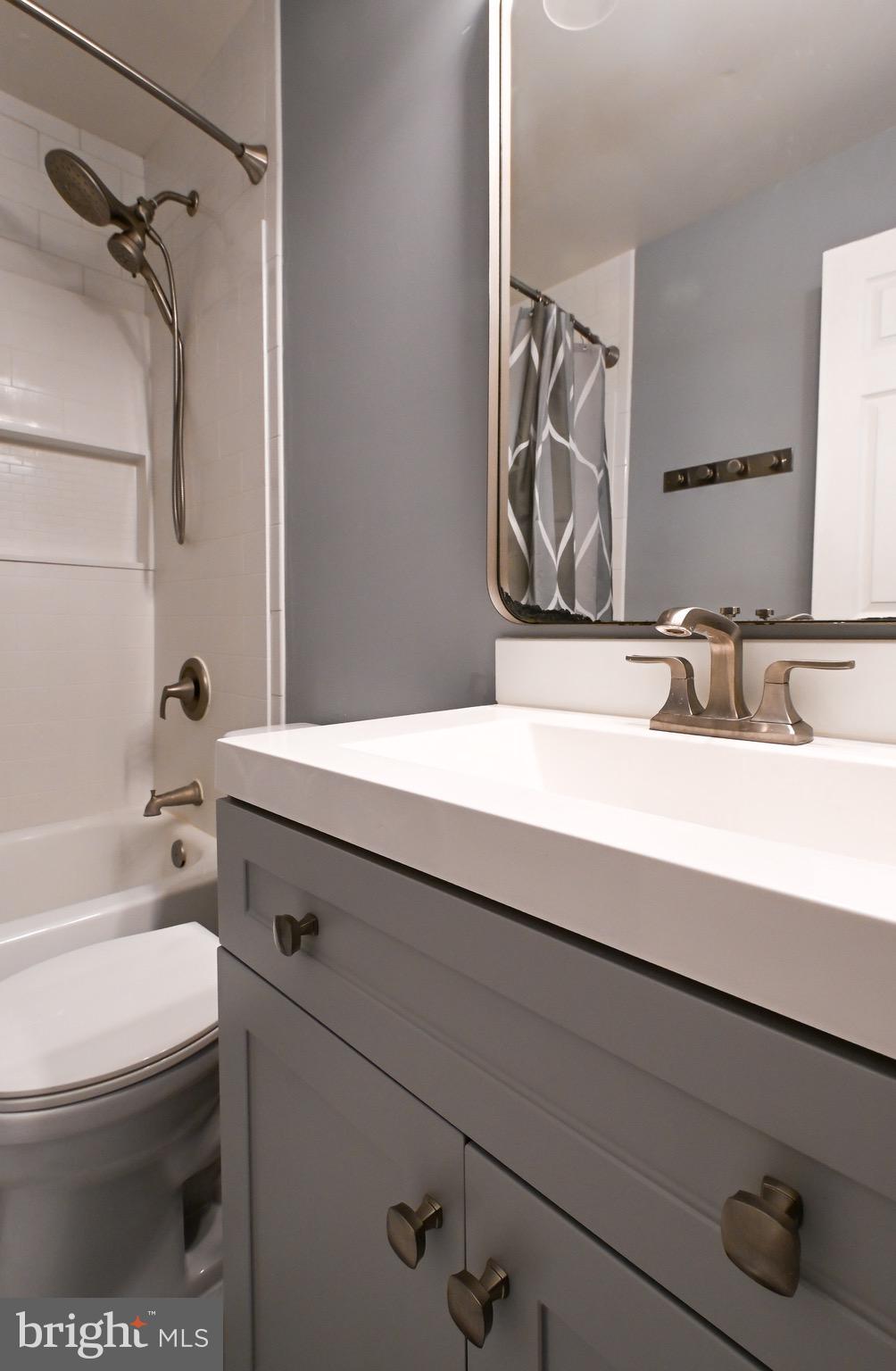 3721 Foxford Stream Road Nottingham, MD 21236 - Photo 27 of 48 a bathroom with a sink a toilet and shower