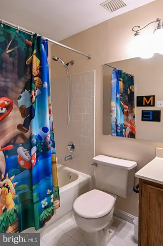 a view of an empty room and bathroom