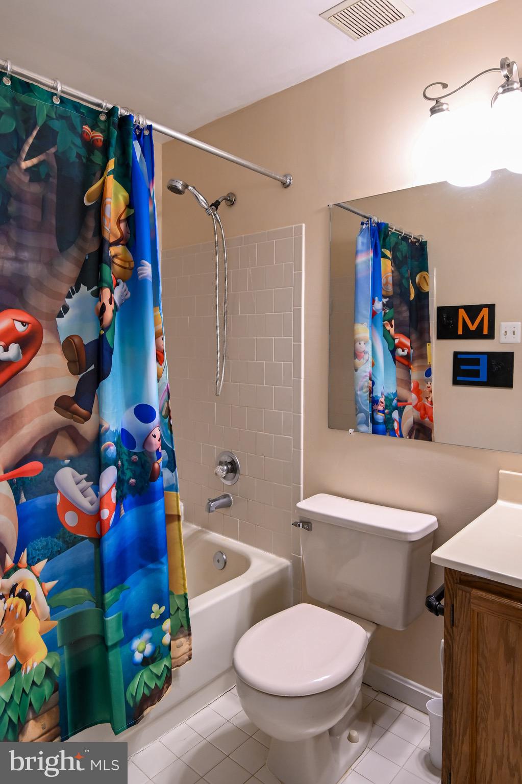 3721 Foxford Stream Road Nottingham, MD 21236 - Photo 32 of 48 a white toilet sitting next to a bathroom sink and tub