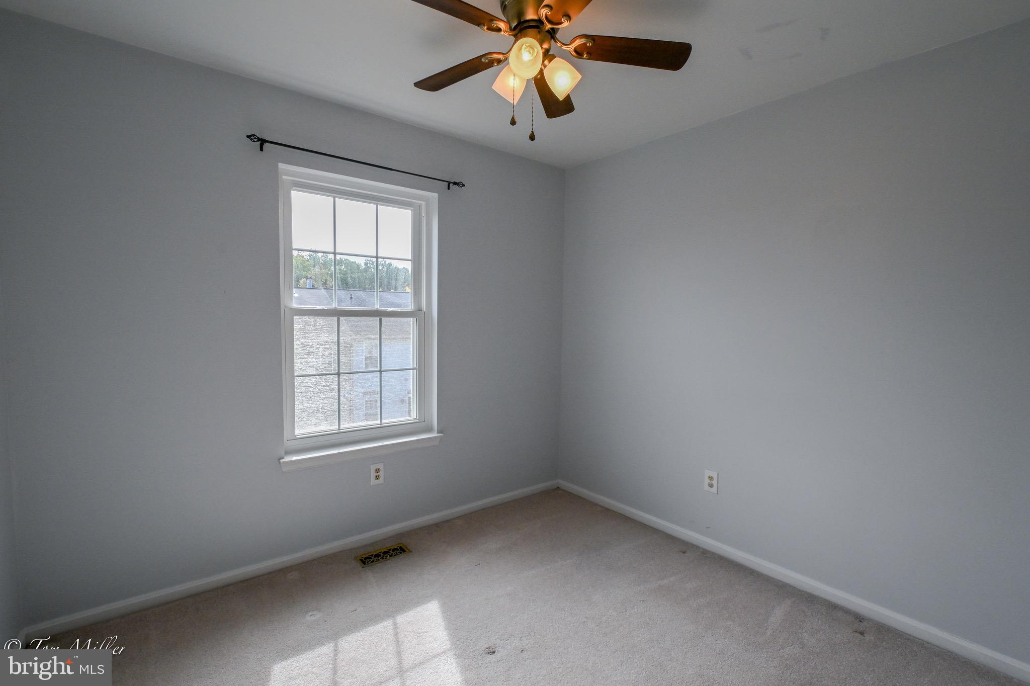 3721 Foxford Stream Road Nottingham, MD 21236 - Photo 36 of 48 an empty room with a window and a fan