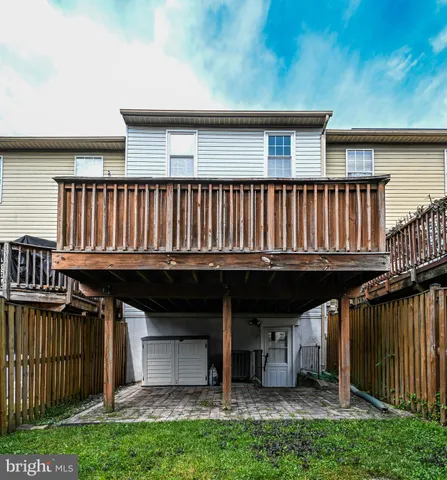 a view of kitchen with furniture and wooden floor